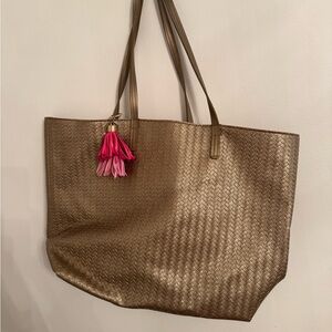 Elegant Gold Tote Bag with Tassel Accent